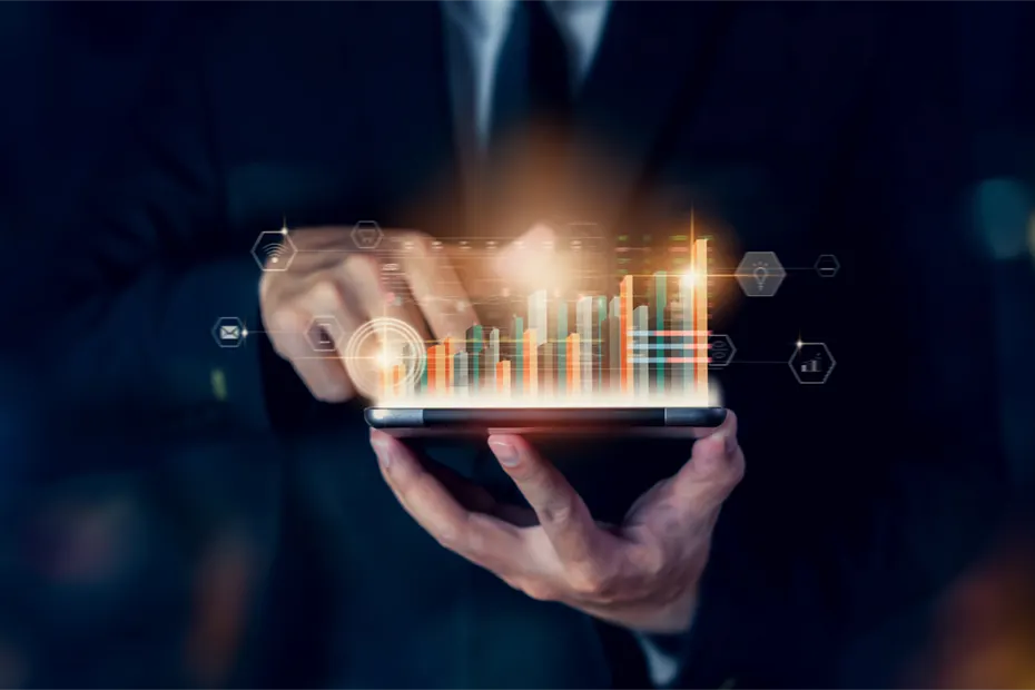 Eine Person in formeller Kleidung arbeitet auf einem Tablet mit leuchtenden Balkendiagrammen. Das Bild steht symbolisch für die Realisierungsplanung, bei der die Analyse von Daten eine Schlüsselrolle spielt, um erfolgreiche Strategien für die Umsetzung von Projekten zu entwickeln. A person in formal attire works on a tablet displaying glowing bar charts. The image symbolizes realization planning, where data analysis plays a key role in developing successful strategies for project execution.